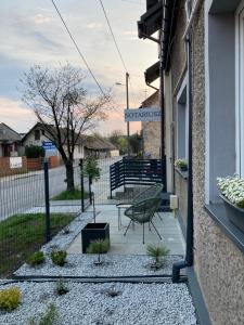 a patio with a bench on the side of a house at Apartament loft Krzeszowice centrum in Krzeszowice