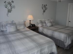 Voodi või voodid majutusasutuse Brunswick Plantation Golf Condo 307M toas +18 fotot