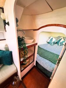 an overhead view of a bedroom in a tiny house at Sirius - Boat House in Olhão