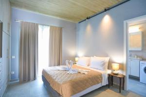 a bedroom with a bed with a towel on it at Villa Christina in Pouládes