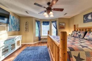a bedroom with a bed and a ceiling fan at High N Dry-Quiet River Access Neighborhood, 1 Mile to Parkway, 5 Miles to Dollywood! in Pigeon Forge +35 photos