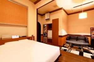 Postel nebo postele na pokoji v ubytování 隠家(ajito) HOTEL555 御殿場2
