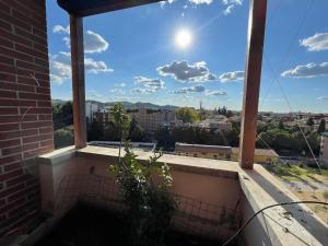 a view of the city from the balcony of a building at Attico con vista spettacolare e Jacuzzi in Bologna
