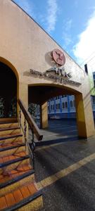 a entrance to a building with a sign on it at Hotel Aitue in Temuco