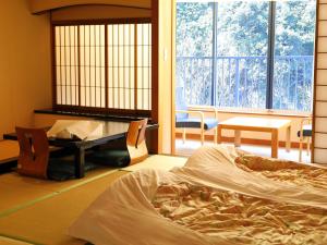 Postel nebo postele na pokoji v ubytování Hakone Pax Yoshino
