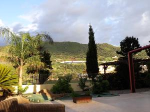 a garden with a view of a mountain at 3 Bed Apt loc Marinella Pizzo Vv 89812 Calabria, Southern Italy in Casa Carrieri