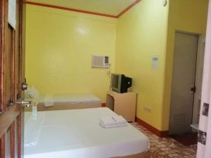 Postel nebo postele na pokoji v ubytování M&E Guesthouse