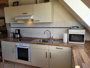 Kuchyň nebo kuchyňský kout v ubytování Ferienhaus Wattenmeerblick