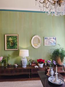 a living room with a table with flowers on it at Hotel Onni in Porvoo