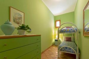 A bed or beds in a room at Dimora Teatro