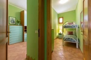 A bed or beds in a room at Dimora Teatro
