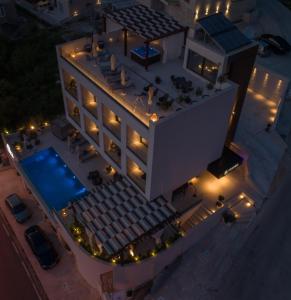 an overhead view of a building with a swimming pool at Boutique Hotel R Palazzo in Kotor