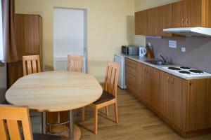 Kuchyň nebo kuchyňský kout v ubytování Apartmány Přízámčí
