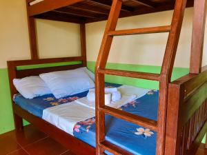 a pair of bunk beds in a room at Marianne's Guest House in New Agutaya