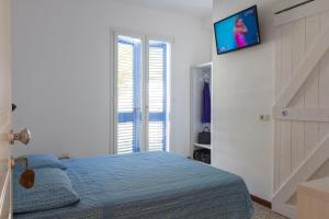A bed or beds in a room at Locanda Villa Fiori
