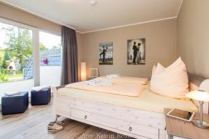 Postel nebo postele na pokoji v ubytování Haus Meeresbrise - Ferienwohnung "Meeresrauschen"