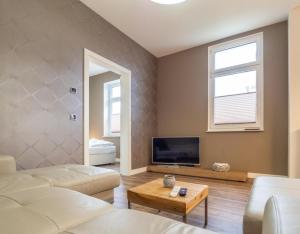 TV a/nebo společenská místnost v ubytování Sassnitz Villa Gössel, WE 3 RZV