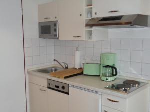 Kuchyň nebo kuchyňský kout v ubytování Hafenresidenz - Ferienwohnung 37