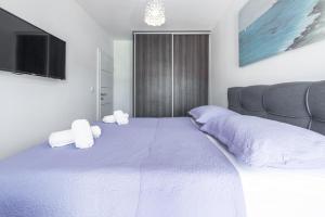 Posteľ alebo postele v izbe v ubytovaní Ana & Mia Apartment