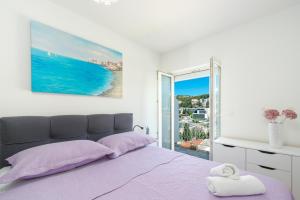 Posteľ alebo postele v izbe v ubytovaní Ana & Mia Apartment