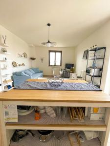 a room with a bed on top of a table at Il Giardino delle Erbe in Badia