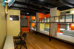 A bed or beds in a room at Trekkers Hostel