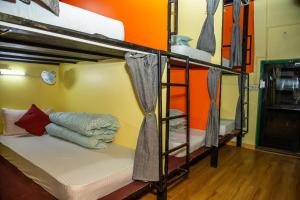 A bed or beds in a room at Trekkers Hostel