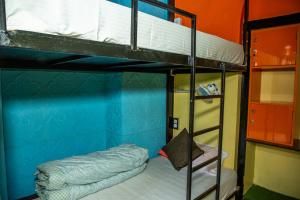 A bed or beds in a room at Trekkers Hostel