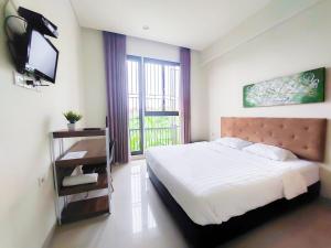 Postel nebo postele na pokoji v ubytování Olivia SOHO Guest House