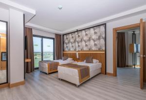 Postel nebo postele na pokoji v ubytování Akadia Luxury Sorgun - Adults Only 16 Plus