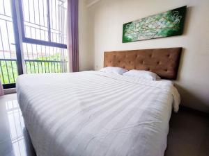 Postel nebo postele na pokoji v ubytování Olivia SOHO Guest House