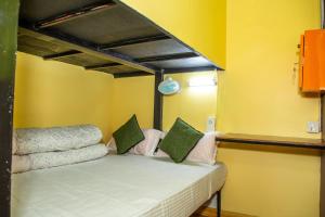 A bed or beds in a room at Trekkers Hostel