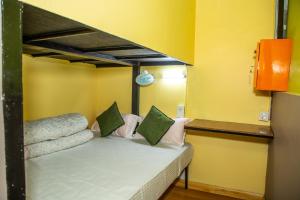 A bed or beds in a room at Trekkers Hostel