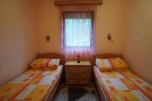 Postel nebo postele na pokoji v ubytování Tara Apartmani Malešević - 1