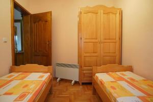Postel nebo postele na pokoji v ubytování Tara Apartmani Malešević - 1
