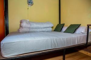 A bed or beds in a room at Trekkers Hostel