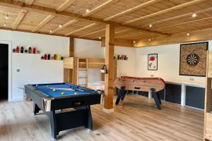 a room with a pool table and a bunk bed at Chalet Of 235 M2 With Balcony Garden In Chamonix in Chamonix