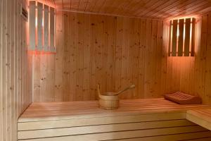 a sauna with a bucket in the inside of it at Chalet Of 235 M2 With Balcony Garden In Chamonix in Chamonix