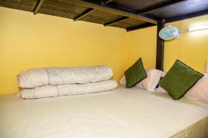 A bed or beds in a room at Trekkers Hostel