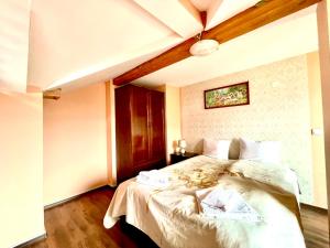 Postel nebo postele na pokoji v ubytování Family Hotel Carpe Diem