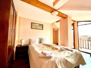 Postel nebo postele na pokoji v ubytování Family Hotel Carpe Diem