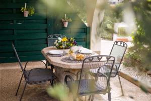 a table and chairs sitting on a patio at Apartment in Vrbnik/Insel Krk 36871 in Vrbnik