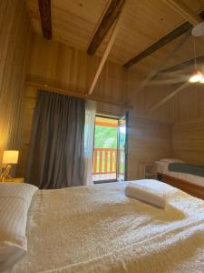 Letto o letti in una camera di Hotel Chubezeni