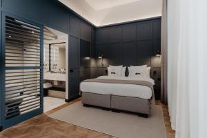 A bed or beds in a room at The Nox Hotel