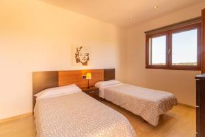 Postel nebo postele na pokoji v ubytování Ses Salines - 38370 Mallorca1