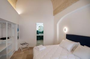 Ένα ή περισσότερα κρεβάτια σε δωμάτιο στο Dimora San Giuseppe Hotel & SPA