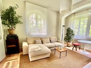 a living room with a couch and a table at Villa Media Luna in Pamplona