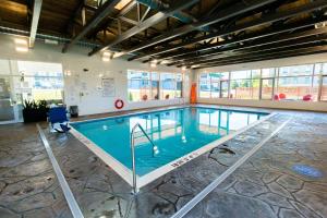 a large swimming pool in a building at Quality Inn & Conference Centre Kingston Central in Kingston