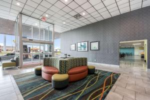 a lobby with a couch and a table in a room at Baymont by Wyndham Oklahoma City Bricktown in Oklahoma City