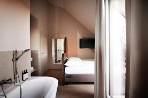 Postel nebo postele na pokoji v ubytování Boutique Hotel das Salz